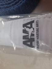 MMA ASPIRE MARITAL ART BELTS. 1 NEW AND 11 USED .  COLOURFUL KARATE BELTS.