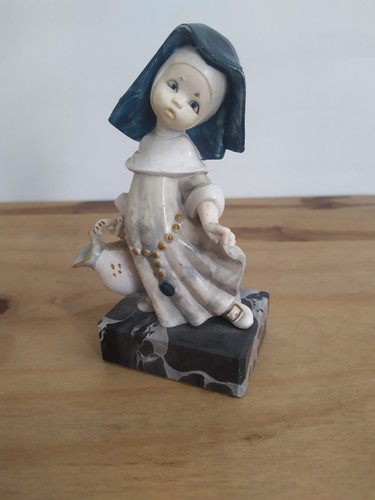 Nun with pitcher figurine - with,