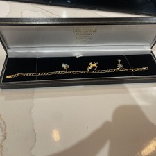 18ct Gold 7.5" Charm Bracelet & 3 x 18ct Gold Charms.
