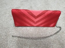 Red glittery clutch bag with