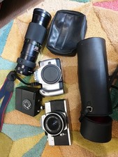 2 Film  Cameras And Accessories Including Lense