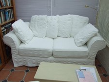 white settee and arm chair, soft comfortable, good condition with loose covers