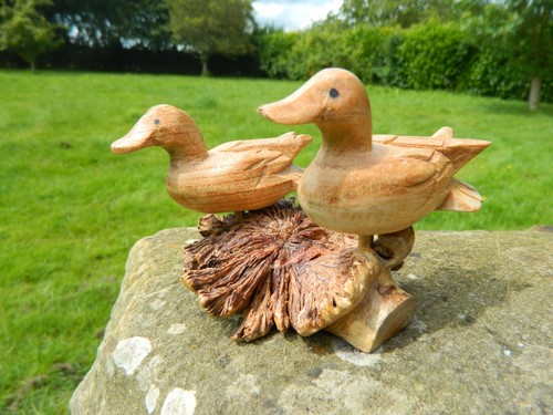 Hand carved ducks parasite - carved,