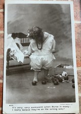Rotary Photographic Series Postcard. Child Attempting To Dress, Nurse Away RP