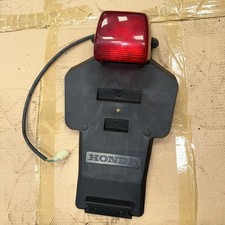 NOS NEW ORIGINAL HONDA DOMINATOR 650 NX650 REAR LIGHT NUNBER PLATE HOLDER -ZUM