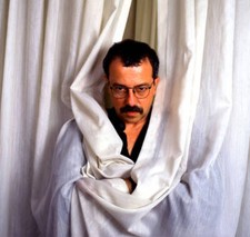 Romanian-born poet, novelist Andrei Codrescu poses Old Photo 4