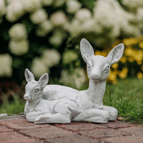 Deer lying with fawn stone