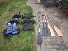 Canadian canoe used with paddles seats and life jackets