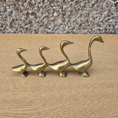 Row vintage brass ducks - vintage,