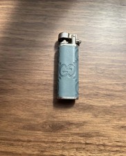 Gas lighter with GUCCI stripe