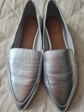 WOMANS NWOT SILVER FLAT SHOES FROM MARKS AND SPENCER IN A SIZE 3