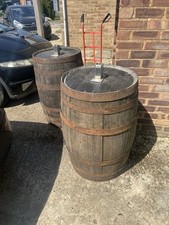 Old Barrels Pair With Light Supports. Whiskey barrels, garden, pub, festival 