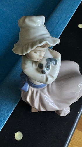 Nao lladro girl holding - by,