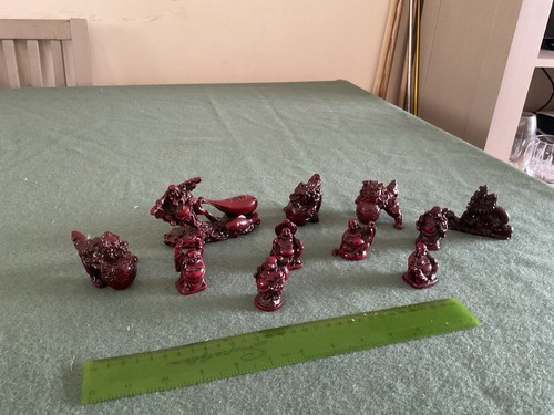Red resin figurines often - red,