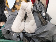 Love To Lounge Slippers with broach on outside lined with fur.