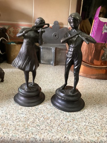 Bronze pair figures pan - of,