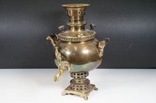 Brass round bodied Samovar with spigot and handles, raised on base stand