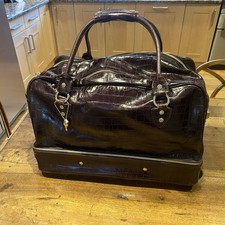 Aspinal of London large weekend/overnight pull along travel bag.