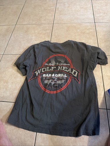Grey shirt features wolf - features,