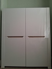 Tall sideboard in white high gloss with a sonoma oak