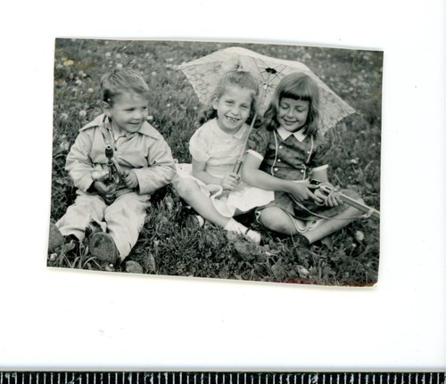 Little girl holding large toy