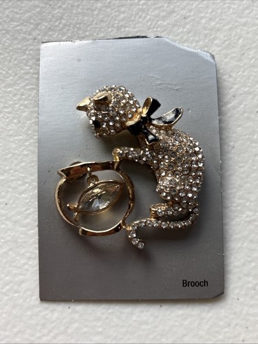 Cat and dangling fish - dangling, in
