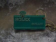 1970’s Rolex Oyster Datejust Swing Tag and Red Chronometer Chip (minor damage)