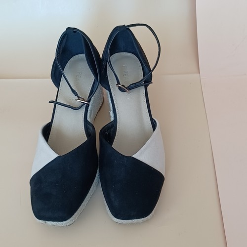 Cream and black espadrilles