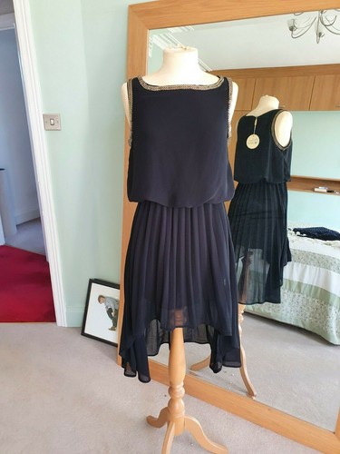 Black chainmail trimmed dress