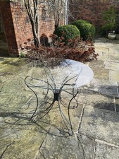 Glass round top black metal patio table - project