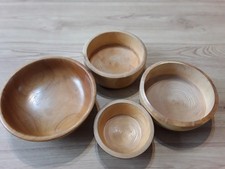 Three matching small bowls, handcrafted, plus another unmatched wooden bowl