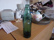 Collectors green bottle with - , a