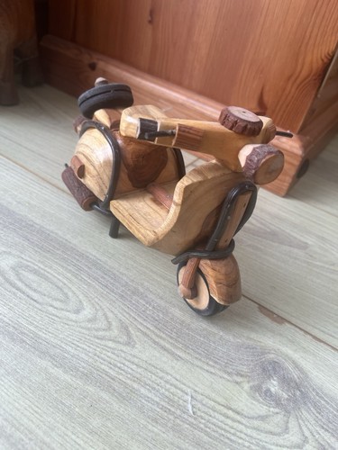 Vespa astride wooden scooter - vespa,