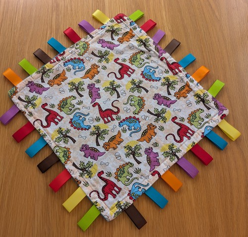 Dinosaur multicoloured taggy - dinosaur,