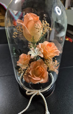 Vintage silk flowers in glass cloche bell jar with wooden base