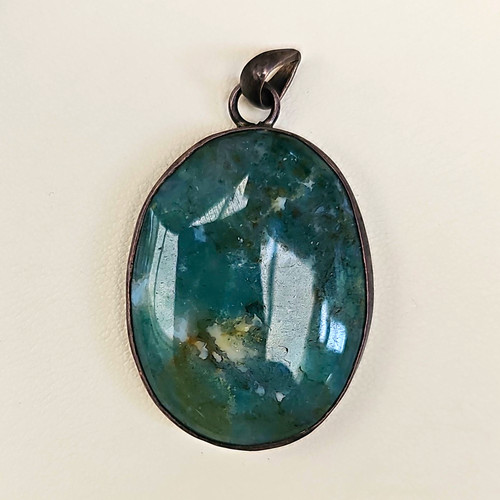 Oval green stone - stone, bezel