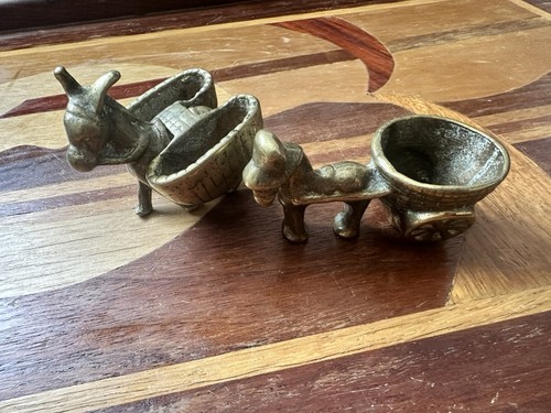 Two vintage brass donkeys - , one