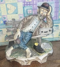 Capodimonte vintage figure old shoeless man on bench with suitcase