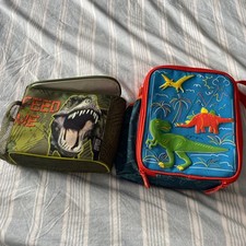 Two dinosaur lunch boxes polar gear and paper chase ex cond 