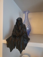 Faceless Sitting Ghost Statue