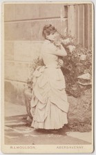 Portrait CDV-lady holding a cat or a dog outside house by Houlson of Abergavenny