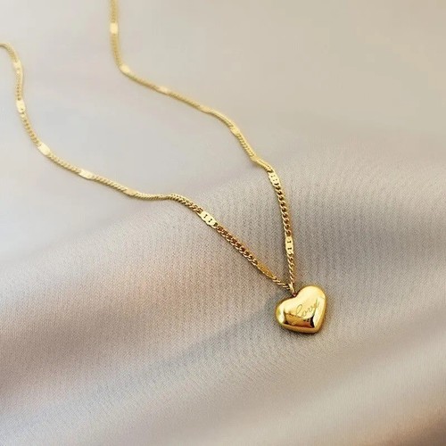 Gold tone heart pendant - tone,