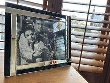 Audrey Hepburn and George Peppard in Breakfast At Tiffany sat on the side mirror