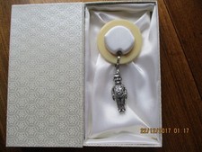Boxed hallmarked silver clown rattle with bakelite teether. Birmingham 1951. VGC