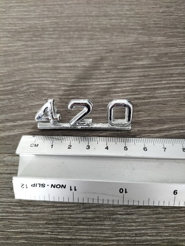 Jaguar 420 car badge.
