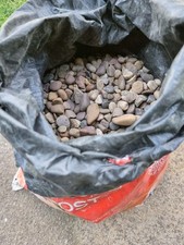 Half Bags of Pea Gravel Mixed Sizes. They Have  Been Used.
