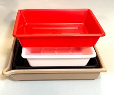 3 8"x10" developing dishes, plus a 12"x14" larger dish for photo printing. 