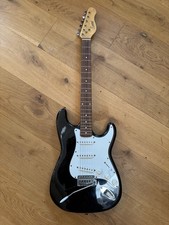 Encore black stratocaster guitar