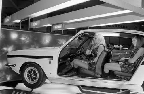 Models pose within cutaway - within, a