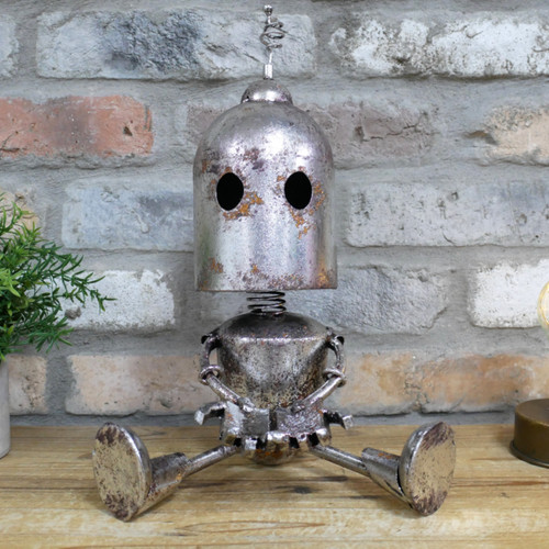 Sitting silver robot - sitting,